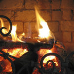 Fireplace,With,Burning,Logs,And,Designed,Barrier,In,The,Foreground