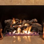 An,Elegant,Gas,Fireplace,Encased,In,Marble,With,Accompanying,Copper